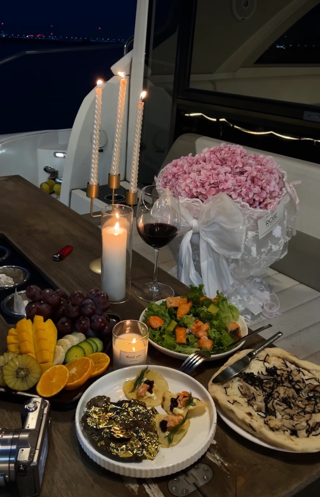 Flowers, candles and dinner aboard a yacht