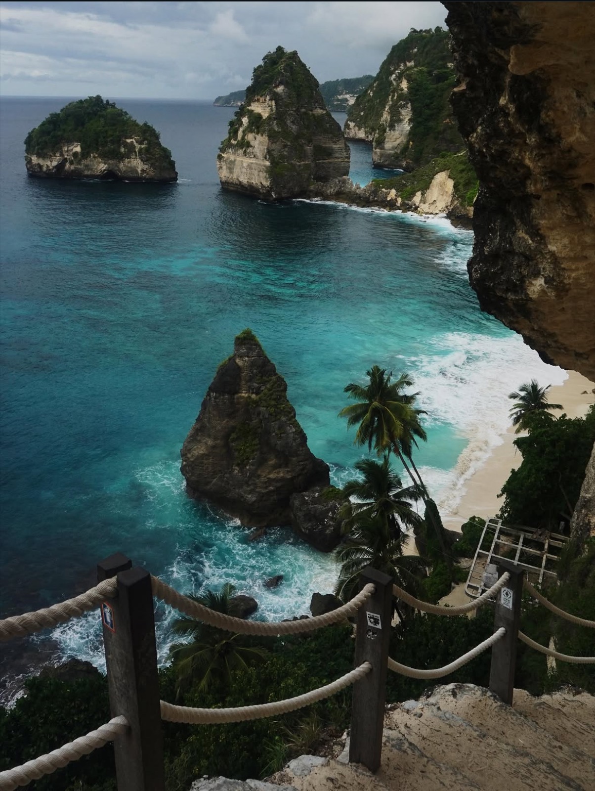 Turquoise sea and steep island cliffs